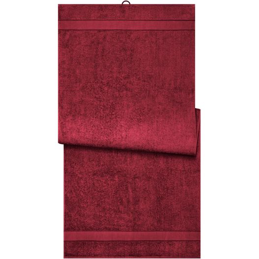 ein rotes handtuch, das an einer wand hängt Sauna Sheet - Saunatuch im modischen Desgin (Bild 1)