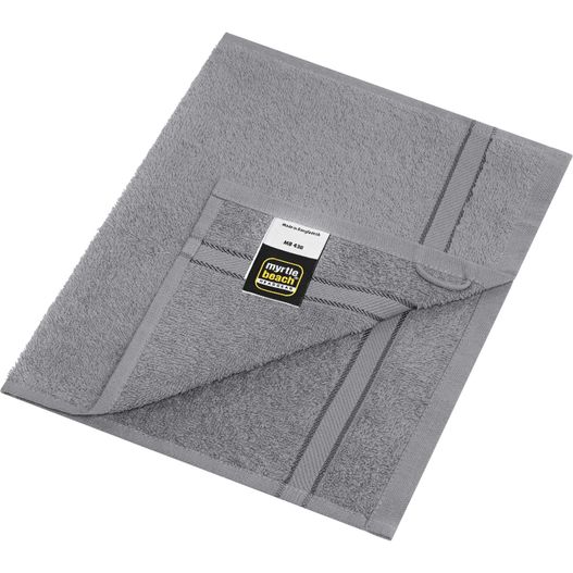 eine gefaltete graue decke mit einem tag darauf Guest Towel - Gästehandtuch im dezenten Design (Bild 1)