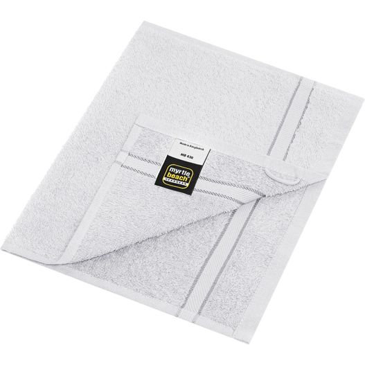ein weißes handtuch auf einer weißen oberfläche gefaltet Guest Towel - Gästehandtuch im dezenten Design (Bild 1)