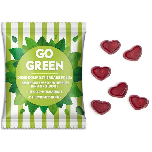 eine tasche von gehen grünen gummy herzen neben einigen gummy herzen Fruchtgummi Standardformen (Bild 1)