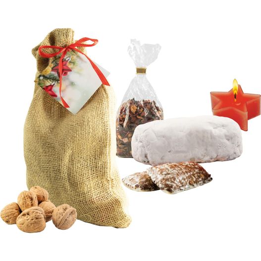 eine tasche von nüssen und eine kerze auf einem weißen hintergrund Süßes Weihnachts-Säckchen (Bild 1)