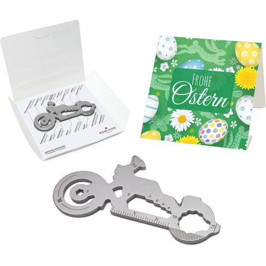 eine box mit einem motorradförmigen flaschenöffner und einer karte ROMINOX® Key Tool Motorbike (21 Funktionen) Frohe Ostern (Bild 1)