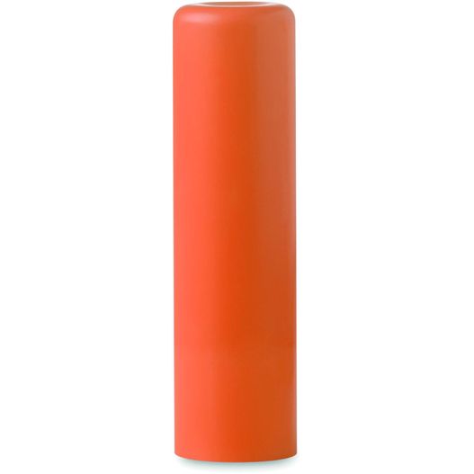eine große orange kerze auf einer weißen oberfläche Lippenbalsam GLOSS (Bild 1)