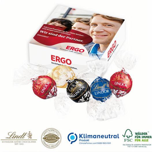 eine schachtel schokolade mit einem mann im hintergrund Lindor-Präsent (Bild 1)